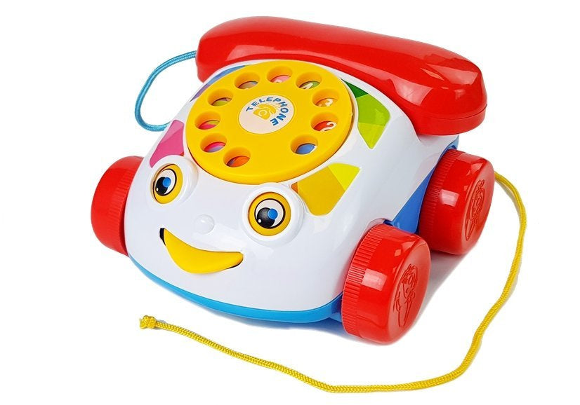 Tahací telefon na kolečkách se sluchátkem a zvuky pro miminka