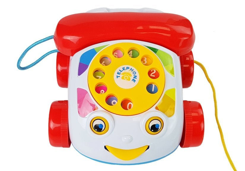 Tahací telefon na kolečkách se sluchátkem a zvuky pro miminka