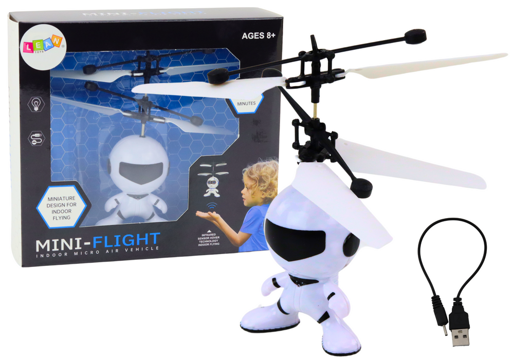 Létající astronaut ovládaný rukou dron helikoptéra bílý