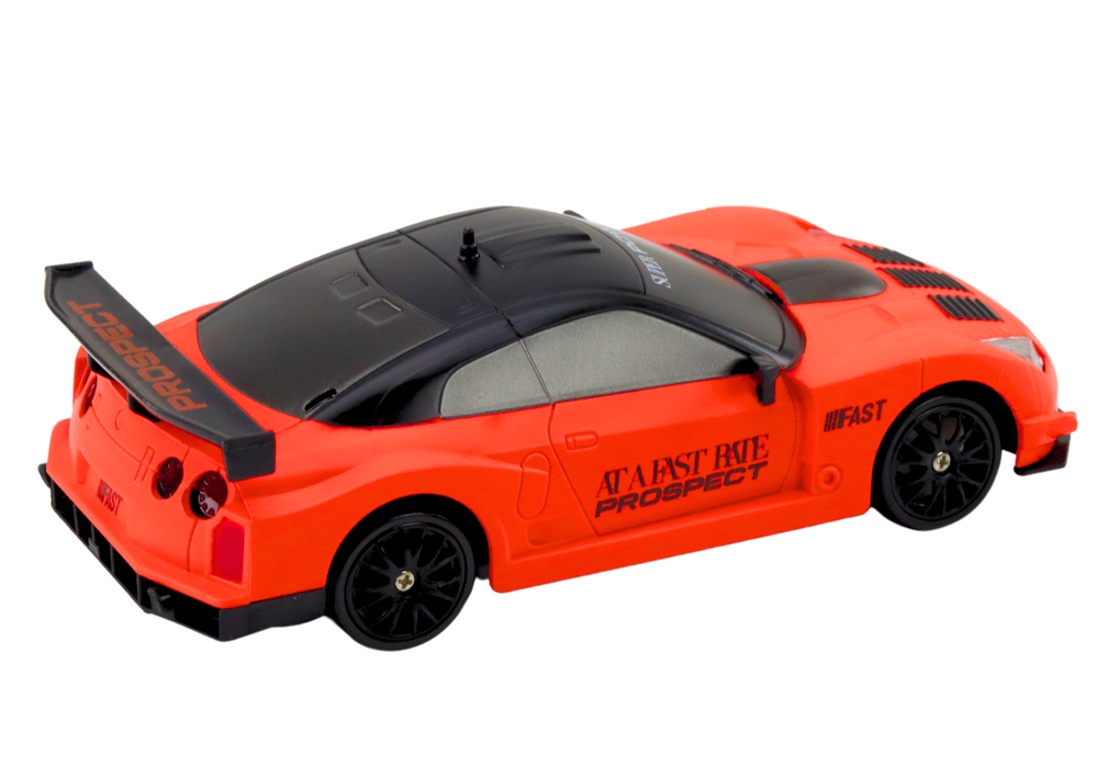 Sportovní auto na dálkové ovládání 1:24 s výměnnými koly oranžové