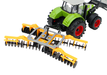 Traktor s kopačkou a talířovou bronou na setrvačník zelený