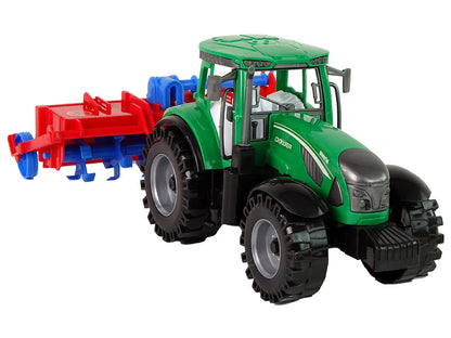 Traktor s pluhem frikční pohon červený