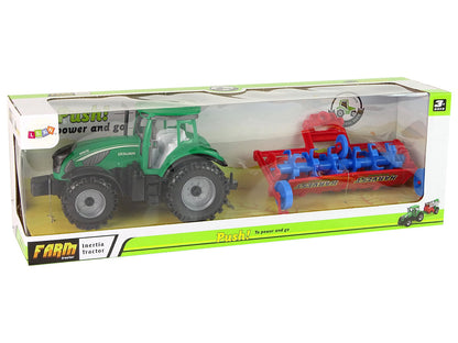 Traktor s pluhem frikční pohon červený