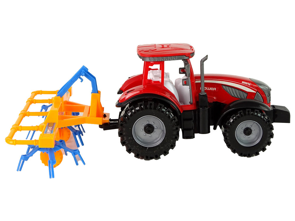 Traktor se shrnovačem frikční pohon červený