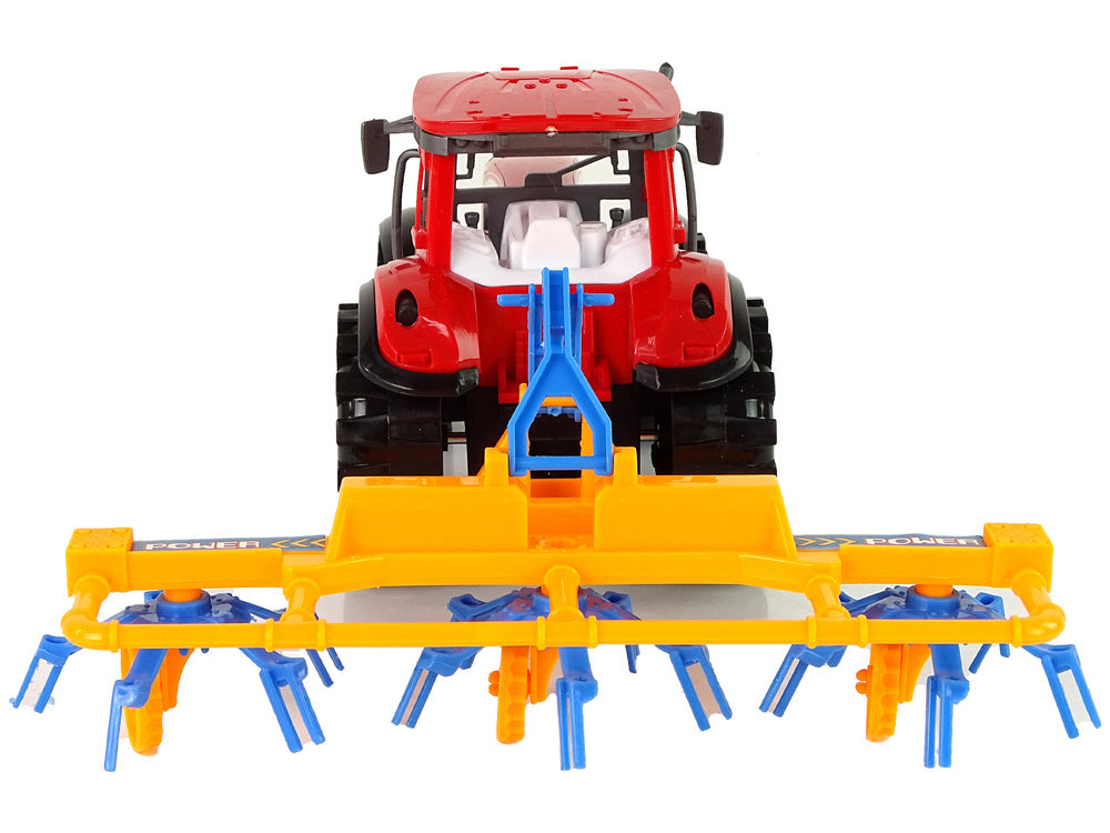 Traktor se shrnovačem frikční pohon červený