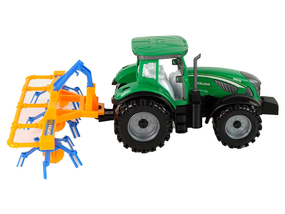Traktor se shrnovačem třecí pohon zelený