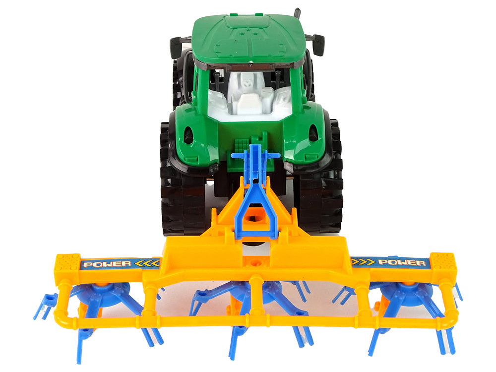 Traktor se shrnovačem třecí pohon zelený