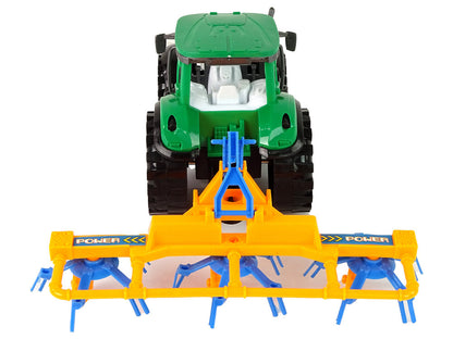 Traktor se shrnovačem třecí pohon zelený