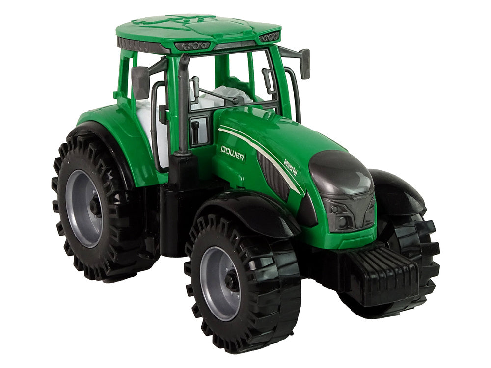 Traktor zemědělský se secím strojem na setrvačník zelený