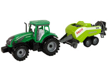 Traktor zemědělský se secím strojem na setrvačník zelený